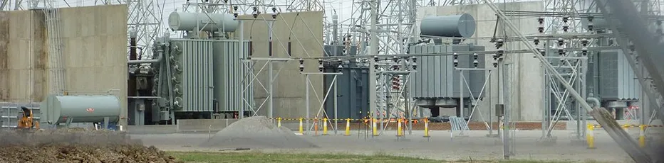 Electrical substation equipment behind security fencing