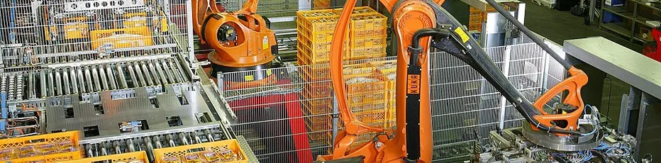 Industrial automation robots moving packaged goods